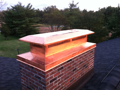 Before and after chimney cap replacement in East Meadow, NY