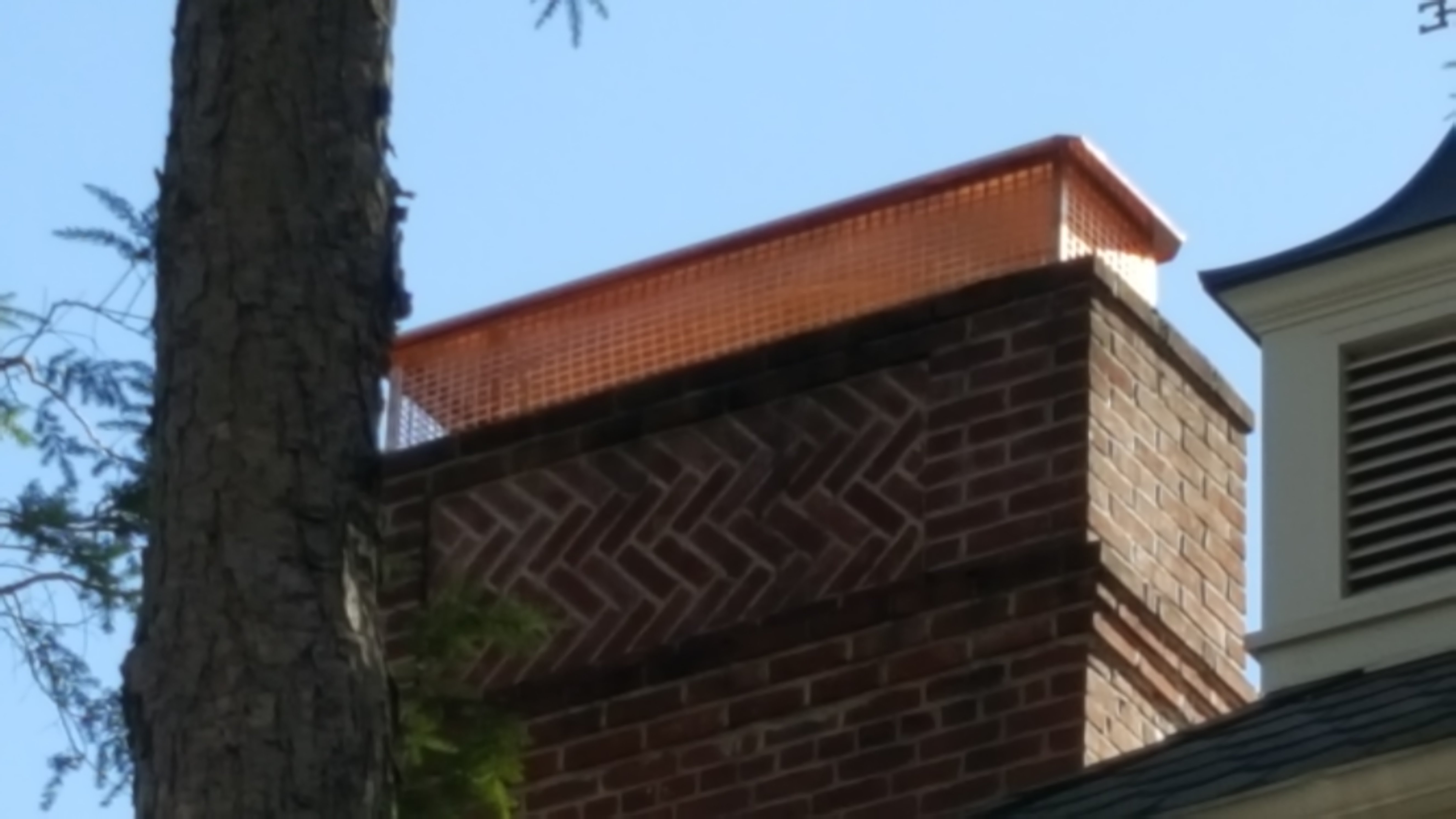 New stainless steel chimney cap installed in East Meadow, NY