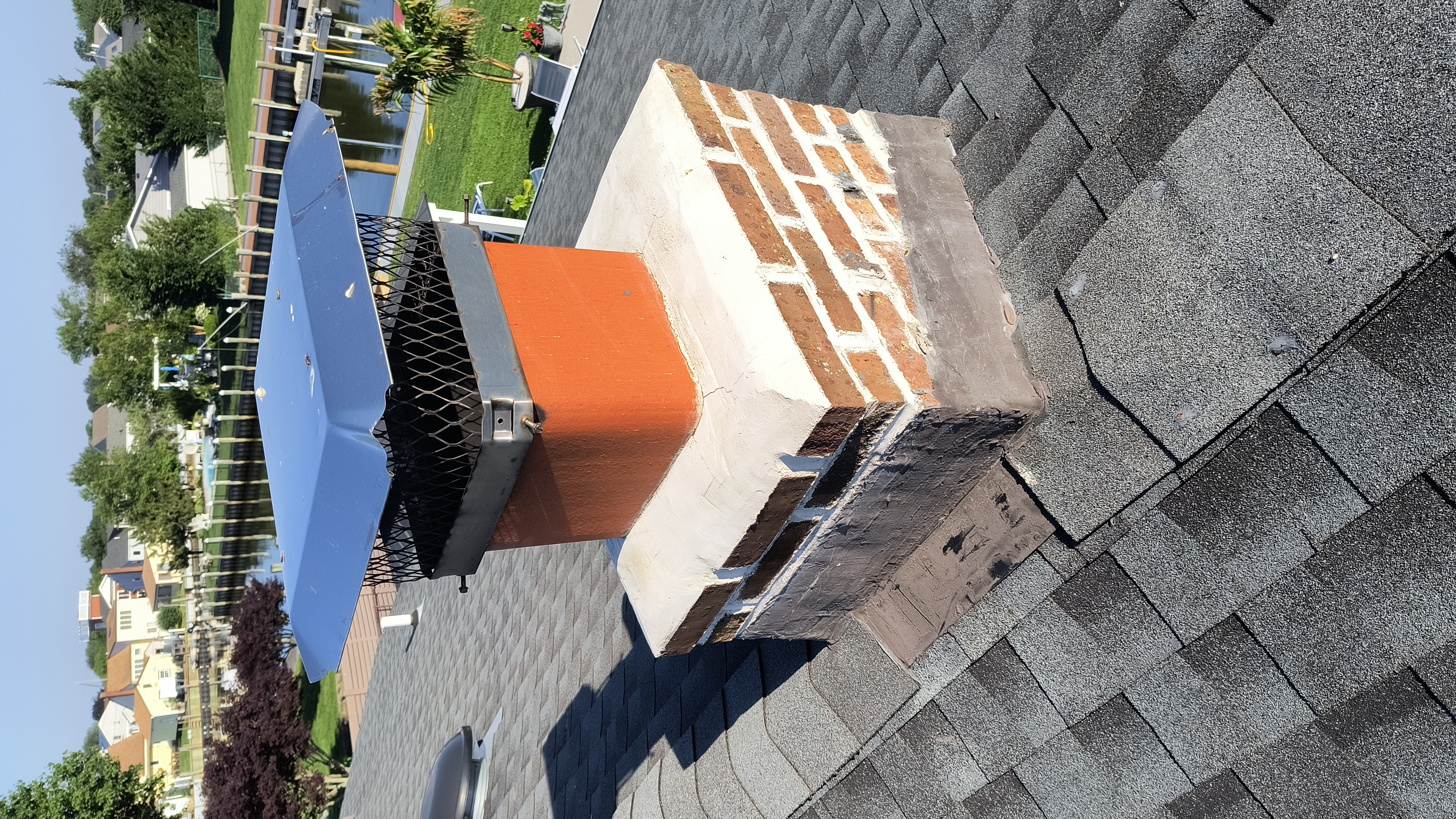 Full chimney masonry rebuild and restoration in East Meadow, NY