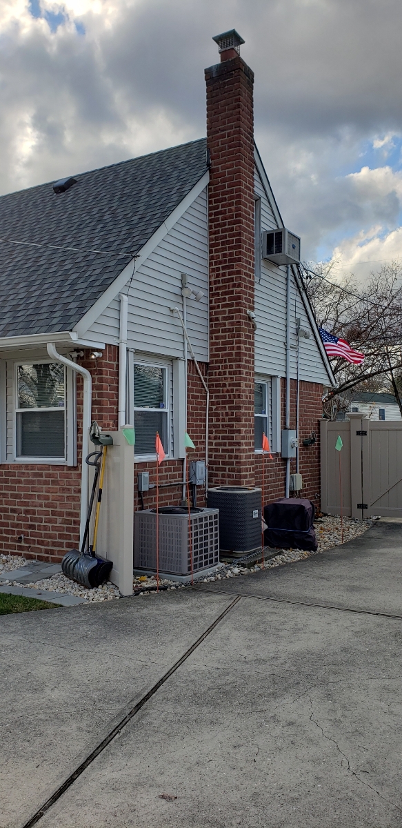 Professional chimney repointing restoring brick joints in East Meadow, NY
