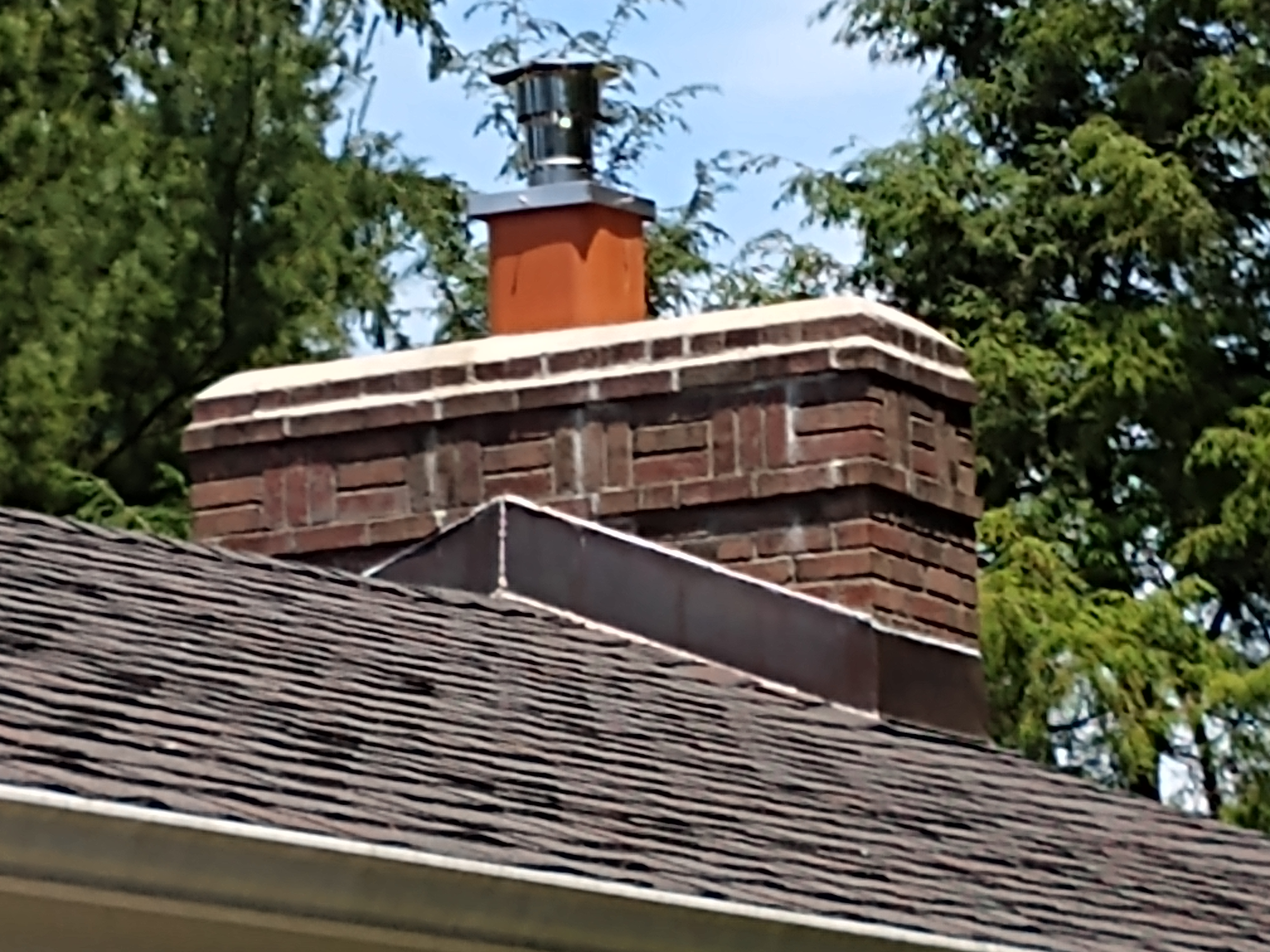 Stainless steel chimney cap with animal guard in East Meadow, New York